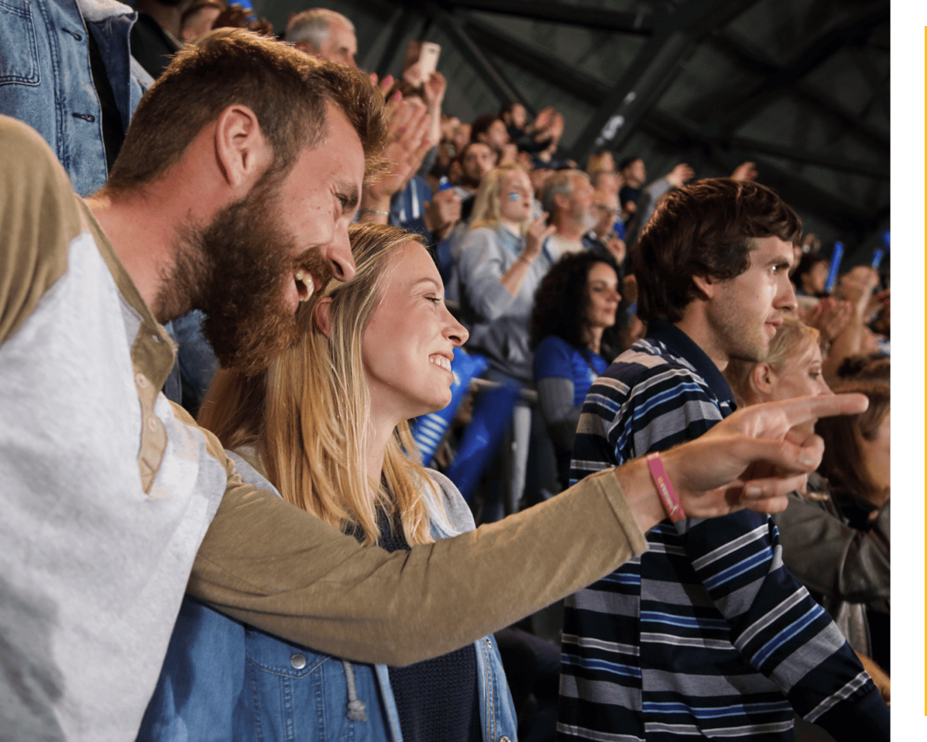 Fans cheering at a sports event